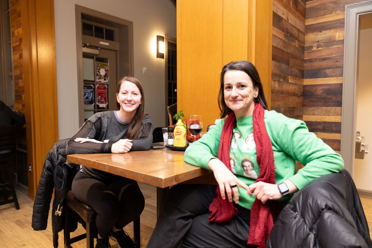 Employees hanging out in the student center living room