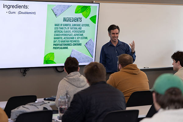 professor lecturing to his chemistry class