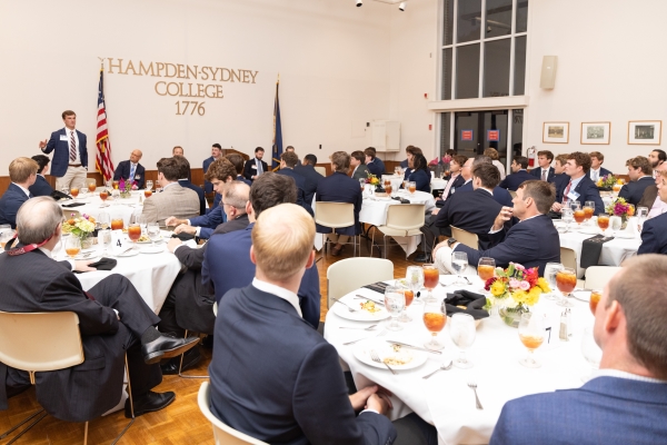 H-SC alumni and students seated together at a large dinner gathering