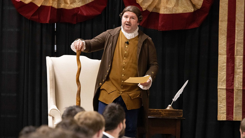 a man performing a revolutionary era reenactment