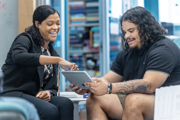 Miranda Rouse with a student in the Rhetoric studio