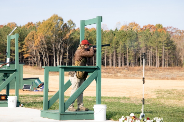 A student standing in a shooting station Slate Hill Shooting Range ribbon-cutting