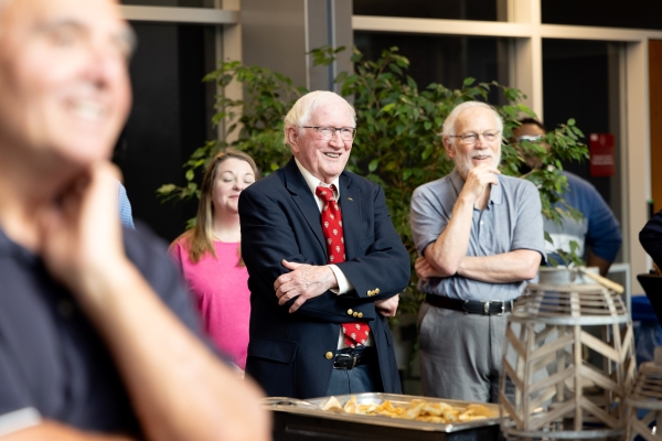 Faculty and community members enjoying a retirement party