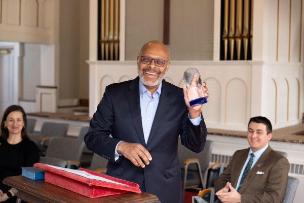 Maurice Jones &rsquo;86 accepting his award at the Spring 2026 ODK initiation at College Church