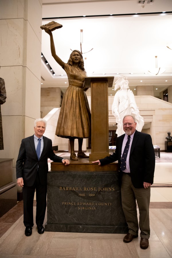 Statue depicting Barbara Rose Johns holding a schoolbook overhead