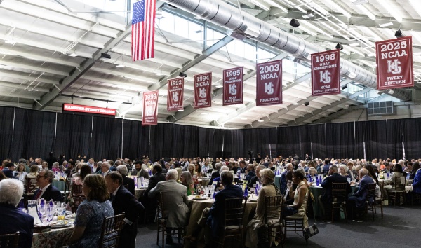 a latge crowd seated for dinner at the conclusion of the capital campaign
