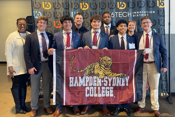 group of Flemming Center students holding an H-SC flag