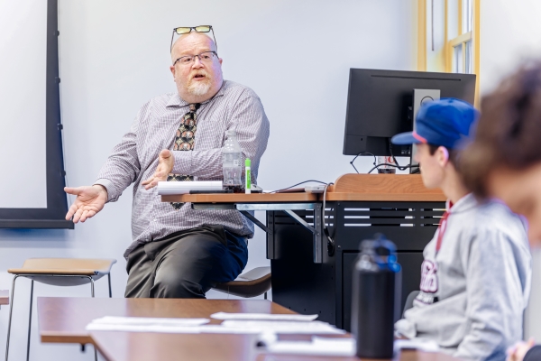 Dr. Frusetta having a class discussion with his students