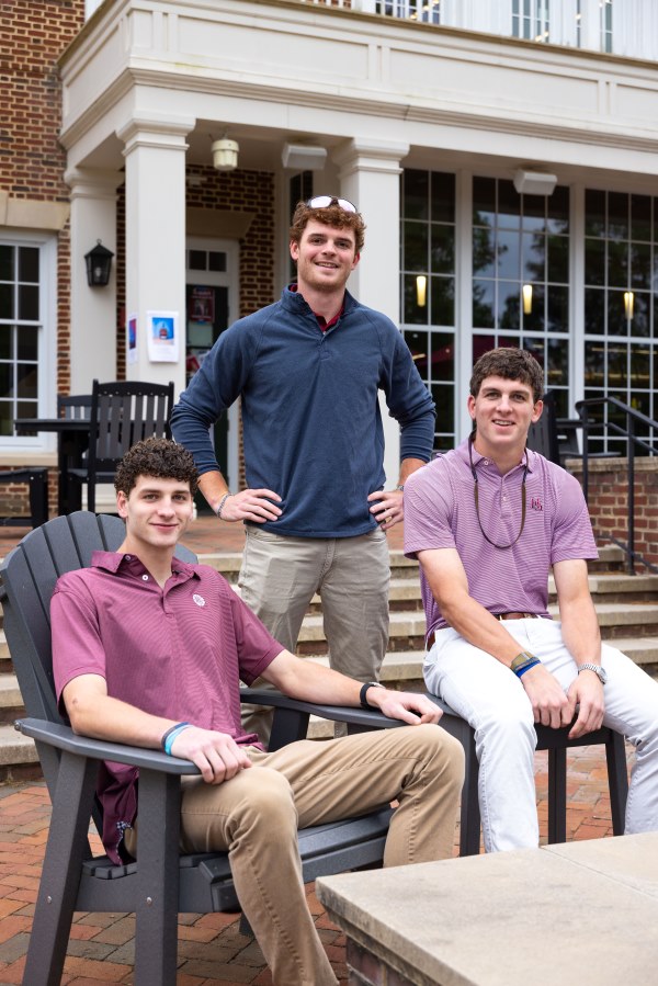 The Messinger brothers sitting on the Brown Center terrace