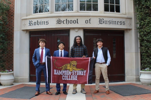 group of Flemming Center students holding an H-SC flag