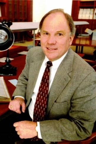 Conley Edwards ’67 sitting at his archivist desk