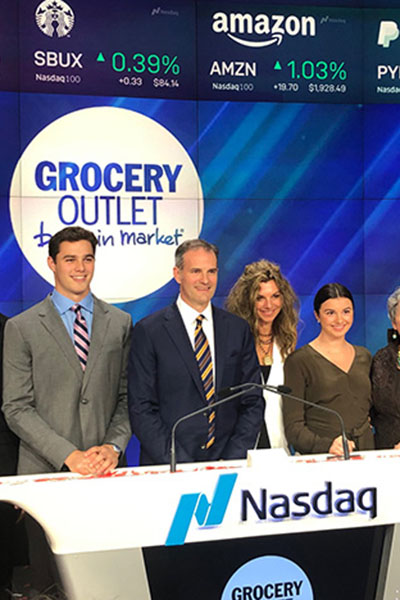 Eric Lindberg and family standing on the floor of the NYStock Exchange