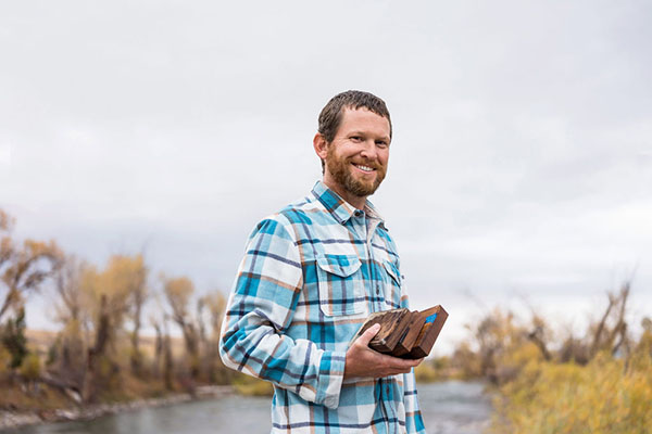 Mike Duncan holding a turtle in a bog