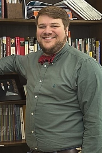 Nathan Ryalls in a library 