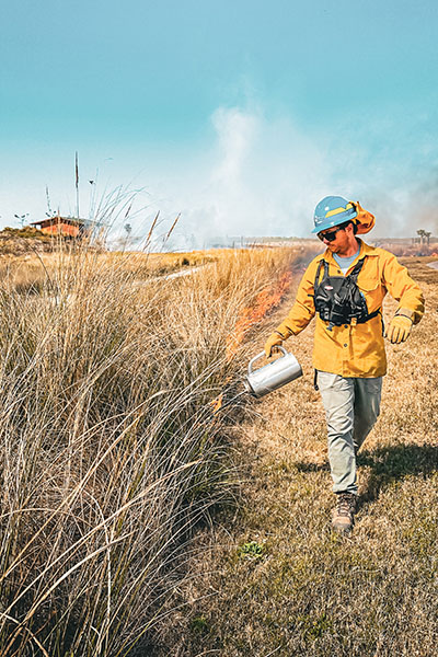 Shaun Swartz creating a prescribed burn blaze