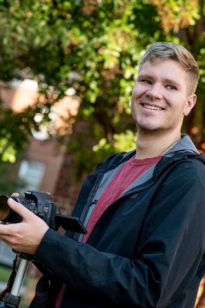 Joey Kelly holding a camera