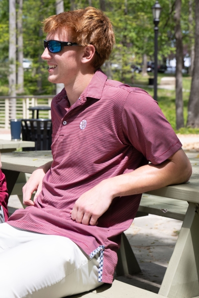 Manning Sutton sitting at a picnic table talking