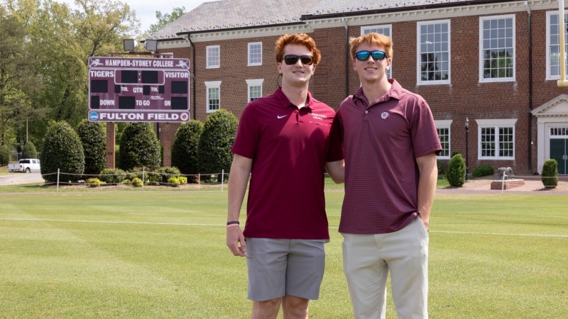 Lasso brothers standing on the football field