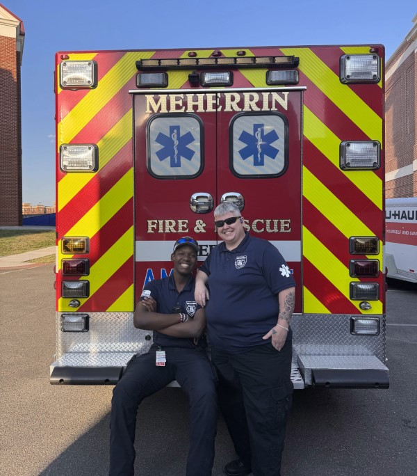 Damien Kerseborn &rsquo;29 in front of a firetruck