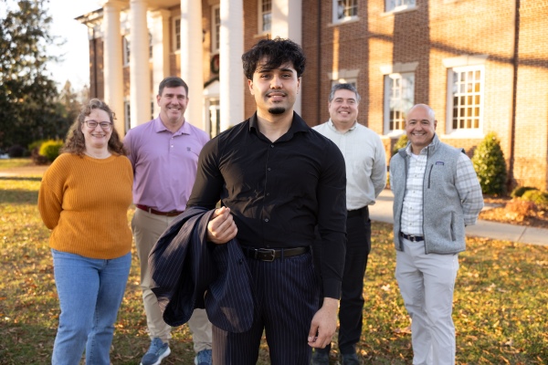 Kamal Iqbal standing together with his Hampden-Sydney mentors and supporters