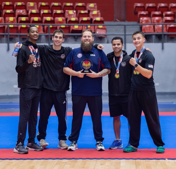 Ryan Sigsbee with his karate group team