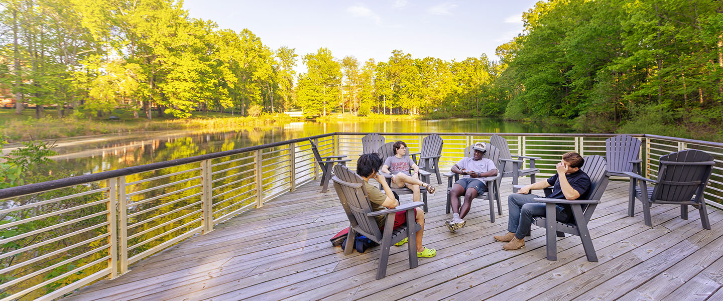 Hampden-Sydney College students gathered in the large deck overlooking Lake Chalgrove