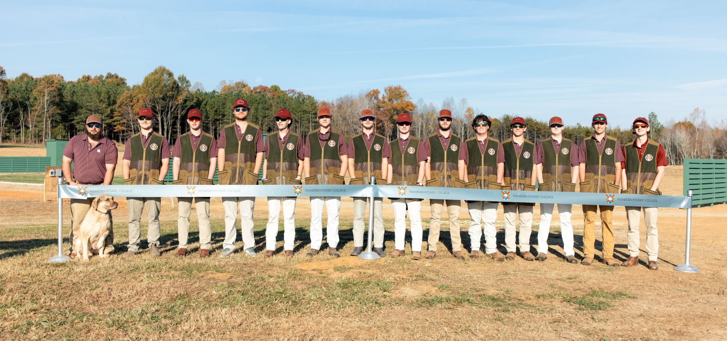 a group picture of the shooting sports team at the shooting sports academy facility