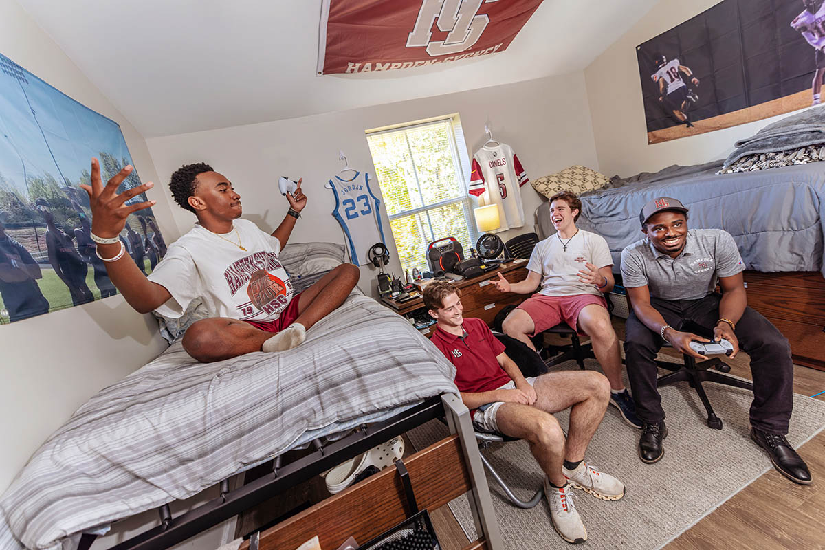 students hanging out and laughing in their room