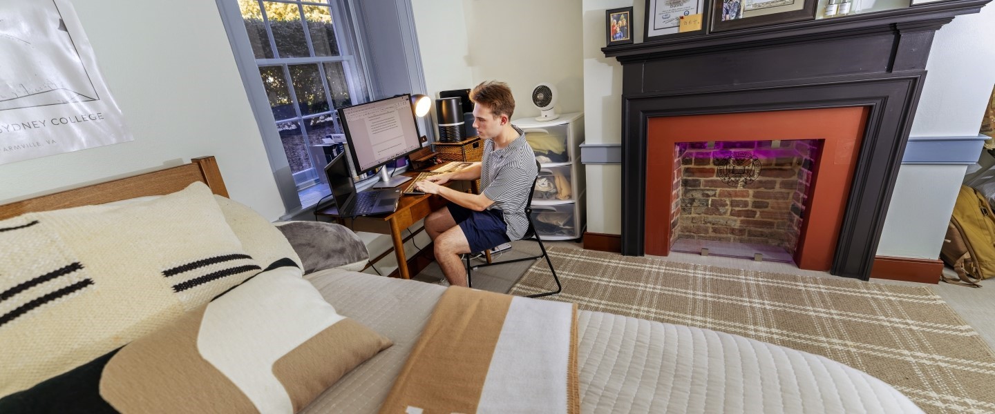 Student hanging out in his historic Venable dorm