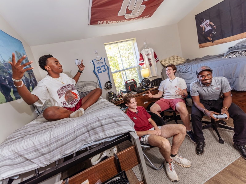students in their dorm room playing video games