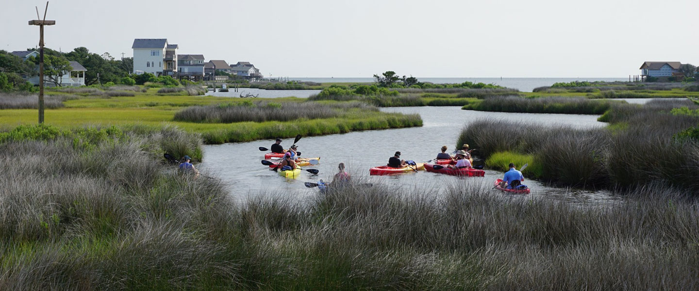 students in kayaks on the river