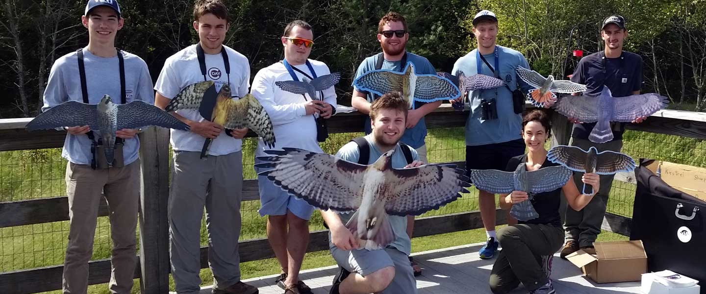 Professor Goodman with students at the raptor center