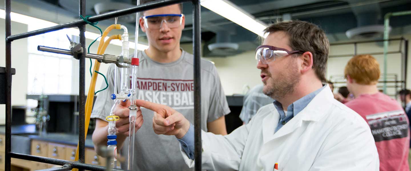 Chemistry Professor Deifel with a student in the laboratory