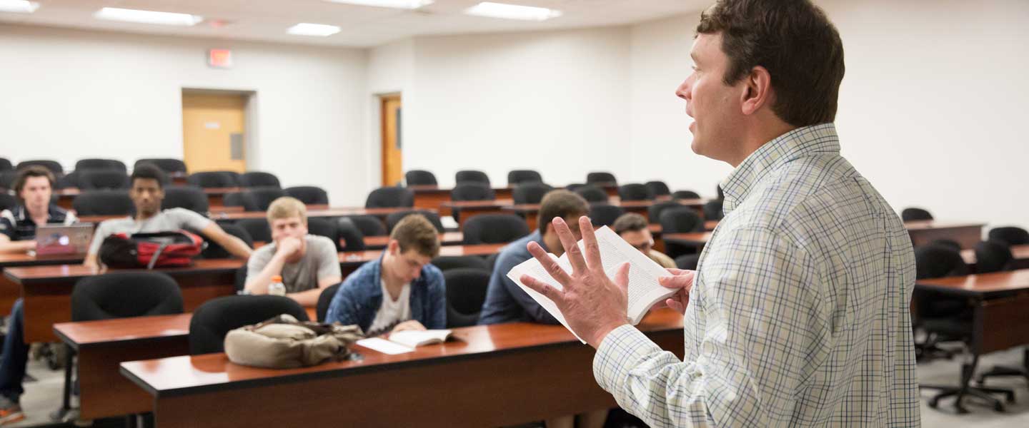 Professor Irons lecturing students in classroom
