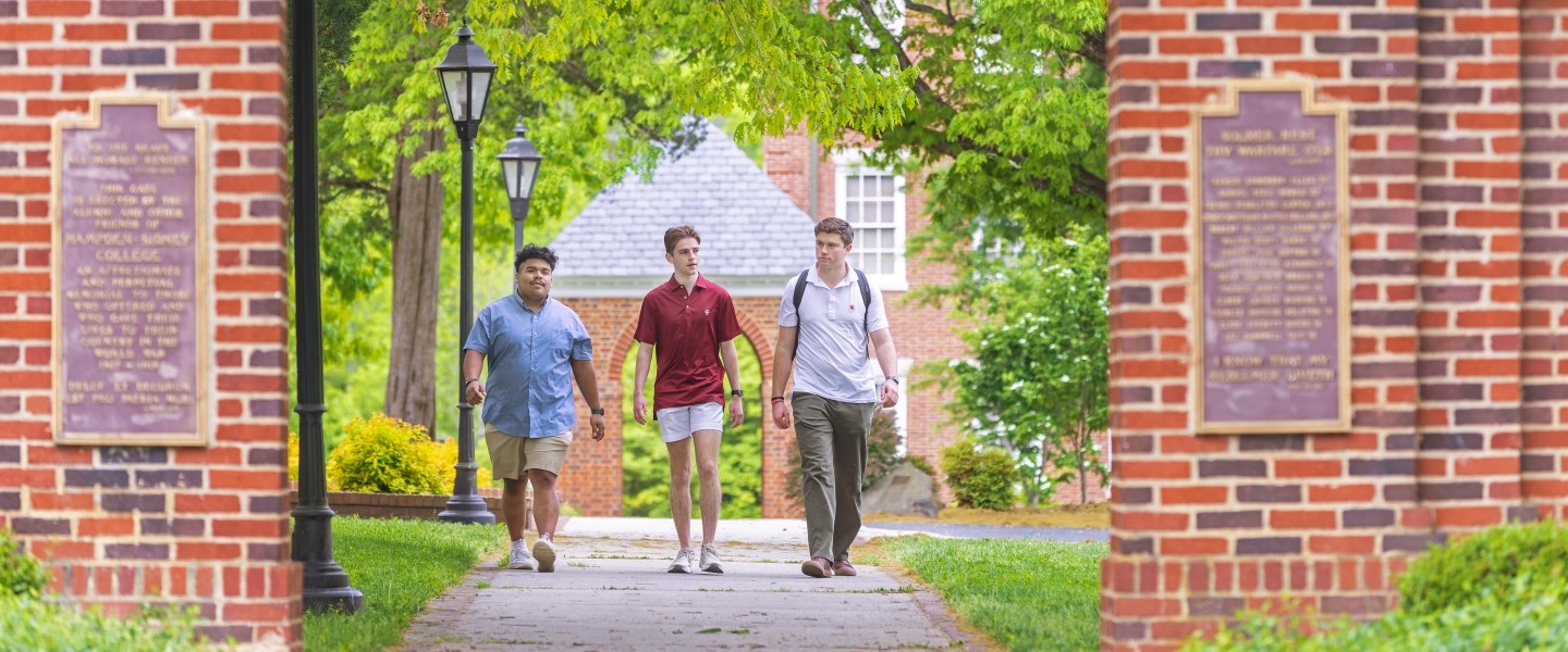 A view of students walking toward Memorial Gate at Hampden-Sydney College