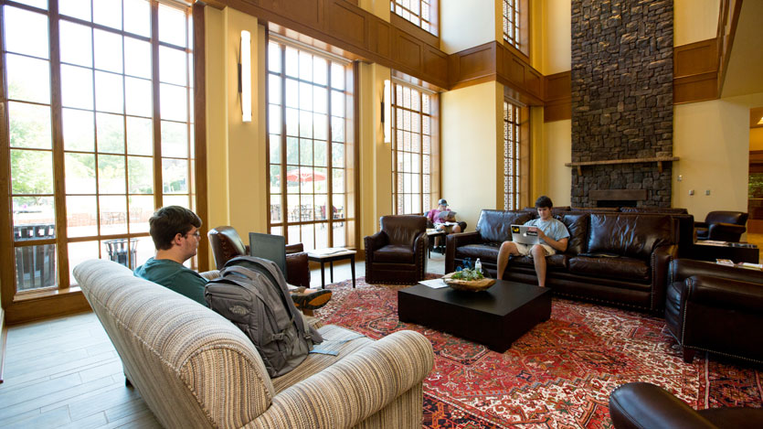 Students lounging in the "great living room" of Brown Student Center