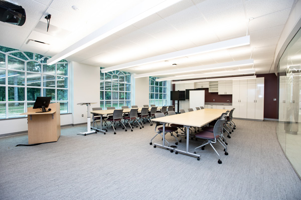 A classroom has windows looking out over Chalgrove Lake.