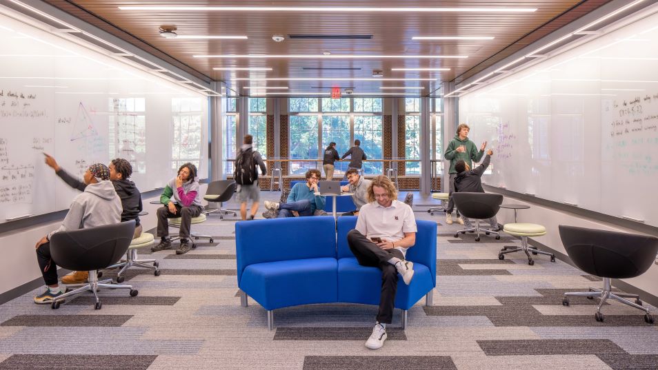 Students working in an atrium corridor in the Pauley Science Center at Hampden-Sydney College