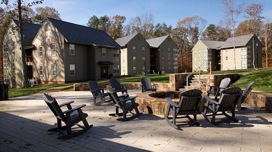 view of the new residence hall in the trees and its courtyard at Hampden-Sydney College