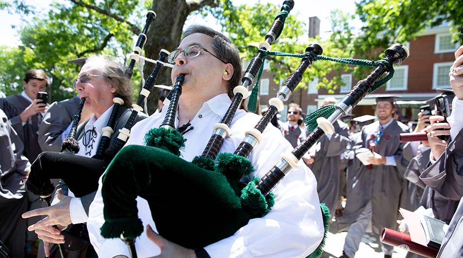 Faculty playing the bagpipes as the process at Commencement 2021 