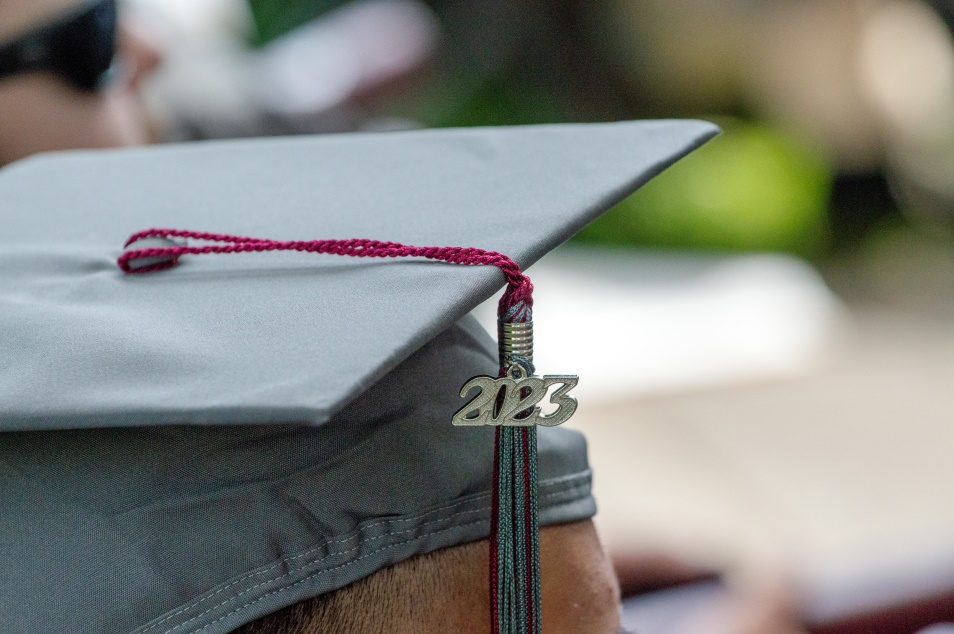 a graduation cap sits atop someone's head