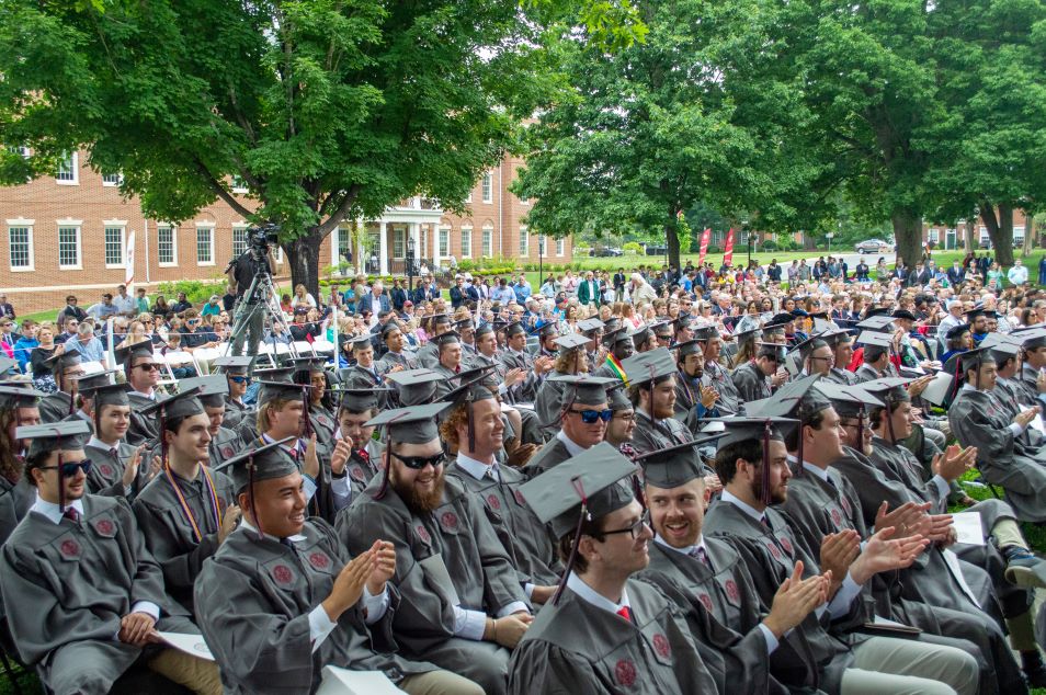 graduates in regalia seated at commencmeent ceremony