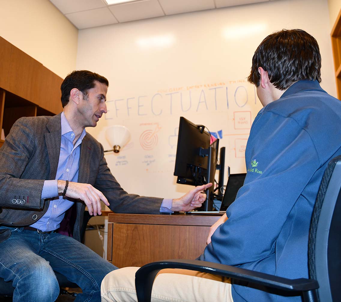 Andrew King consults a student