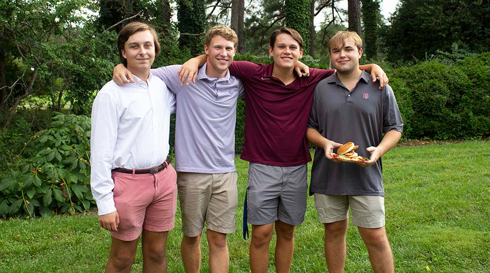 New students posing and smiling at the President's picnic