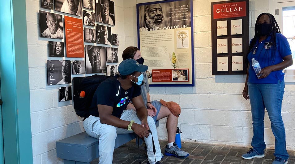 students resting in front of a Gullah history museum