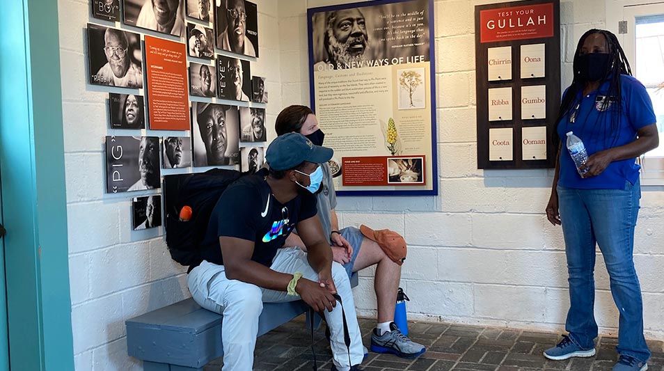 students resting in front of a Gullah history museum