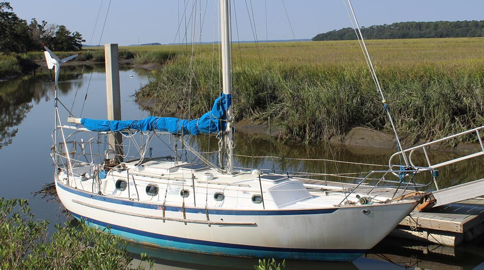 a sailboat resting at a dock