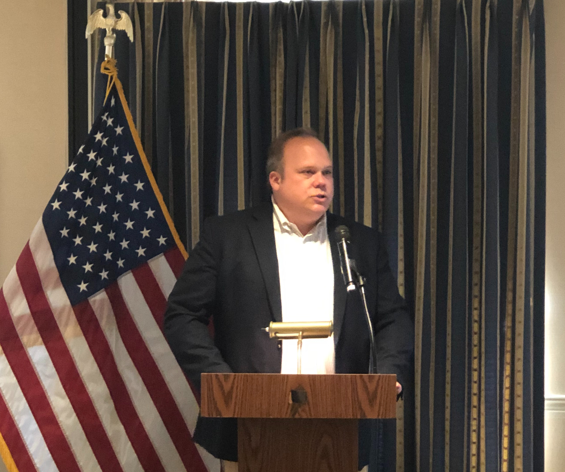Chris Stirewalt speaking at a podium