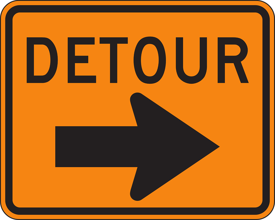 traffic alert sign that says, "detour"