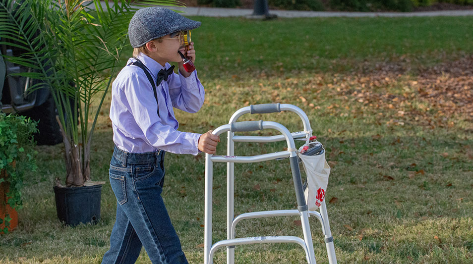 child dressed up as an elderly person on Halloween 